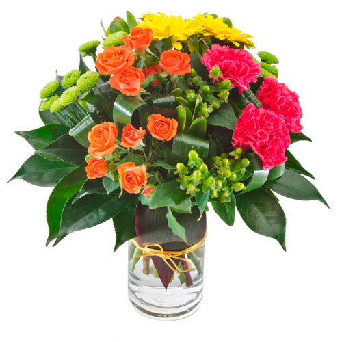 Bright bouqet of flowers in clear vase