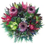 Sympathy wreath containing assorted native flowers and foliage