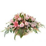 Basket filled with pastel coloured flowers
