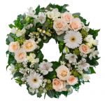 Pastel, pink and white cluster wreath suitable for service.