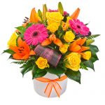 Bright flower arrangement in ceramic container